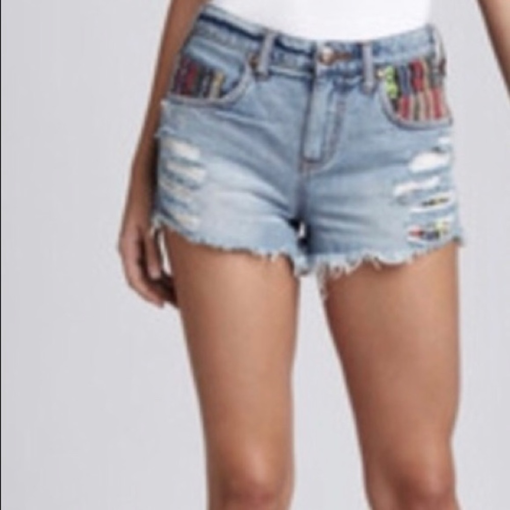 Free People distressed cut off shorts.
